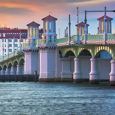 The Bridge of Lions in St. Augustine, Florida, spans the Matanzas River at sunset.